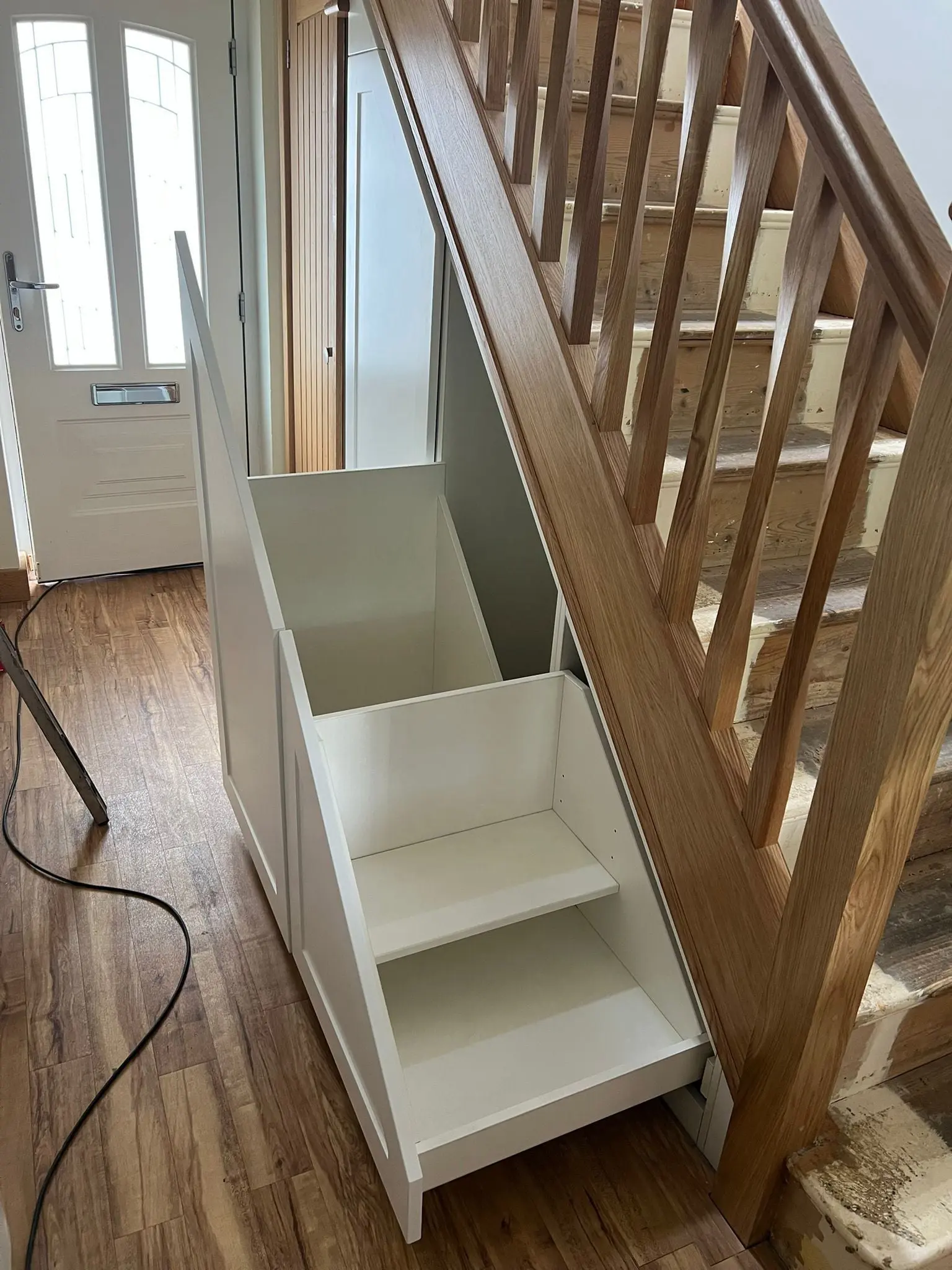 Custom under stairs pull-out drawers maximising storage space in Greater Manchester